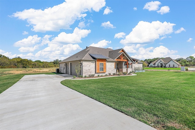 view of front facade with a garage and a front lawn