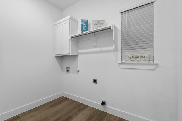 clothes washing area featuring hookup for an electric dryer, dark hardwood / wood-style flooring, cabinets, gas dryer hookup, and washer hookup