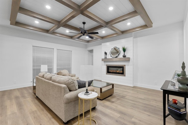 living room with light hardwood / wood-style floors, ceiling fan, beam ceiling, and coffered ceiling