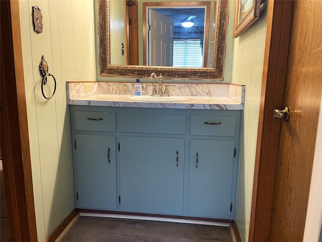 bathroom with wood-type flooring and vanity