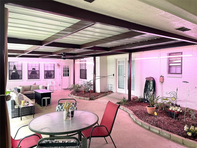 view of patio featuring ceiling fan and an outdoor living space