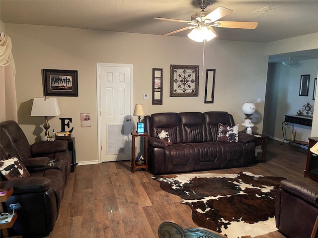 living room with ceiling fan and hardwood / wood-style flooring