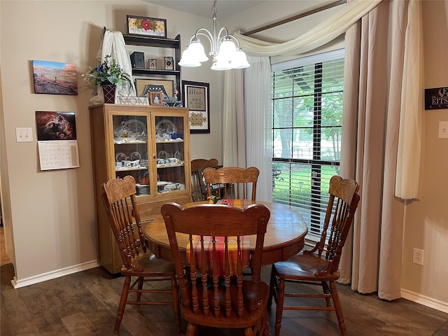 dining room with a chandelier and dark hardwood / wood-style flooring