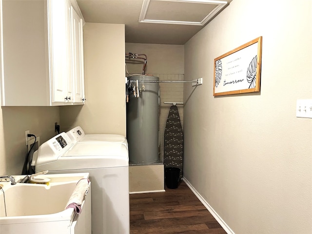 clothes washing area featuring gas water heater, dark hardwood / wood-style flooring, cabinets, washing machine and dryer, and sink