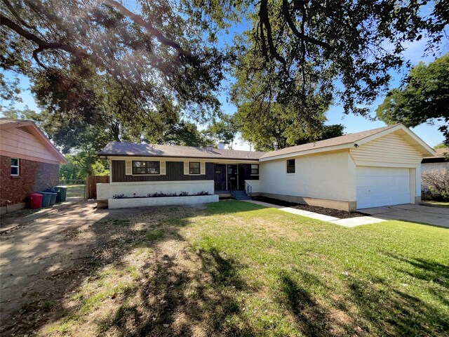 single story home with a front lawn and a garage