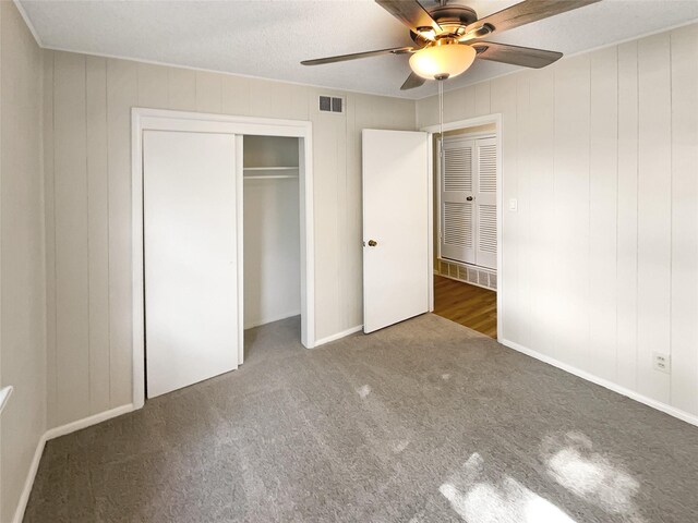 unfurnished bedroom with ceiling fan, hardwood / wood-style flooring, and a textured ceiling