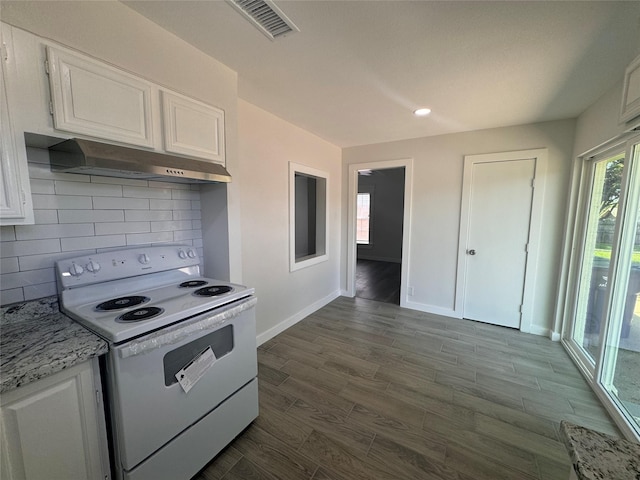 kitchen featuring hardwood / wood-style flooring, white cabinetry, light stone counters, decorative backsplash, and white electric stove