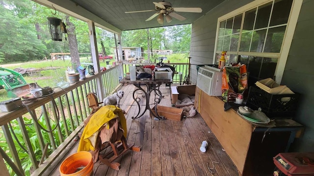 deck featuring ceiling fan and cooling unit