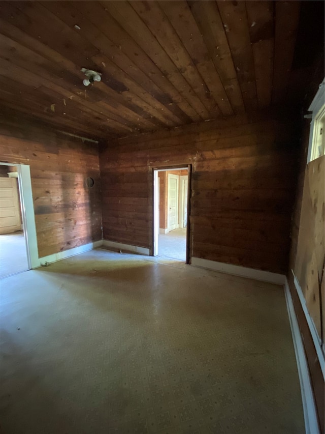 empty room with wooden walls and wooden ceiling