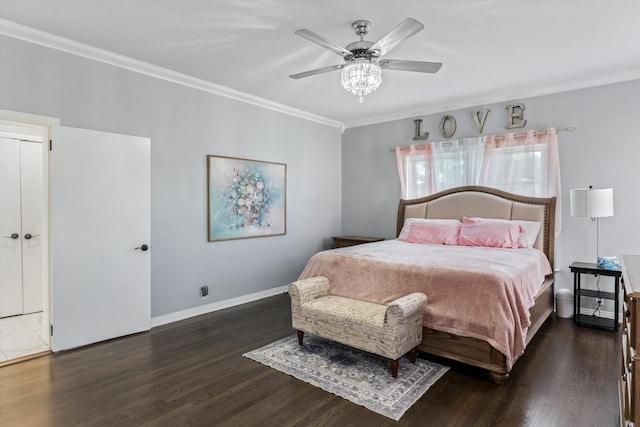 bedroom with ceiling fan, crown molding, and dark wood-type flooring