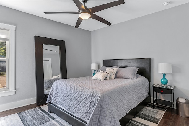 bedroom with ceiling fan and wood-type flooring