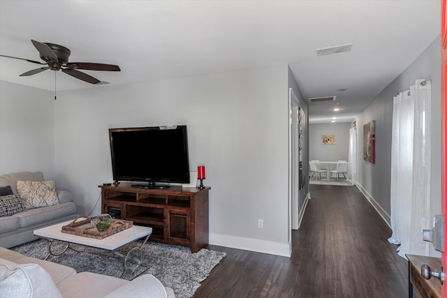 living room with ceiling fan and wood-type flooring