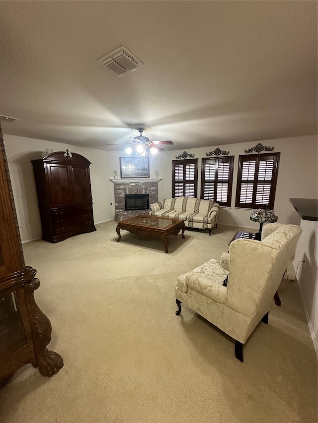 carpeted living room with ceiling fan