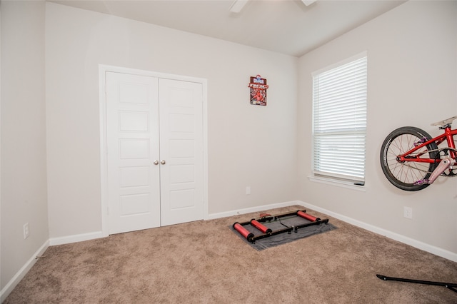 workout area featuring carpet flooring