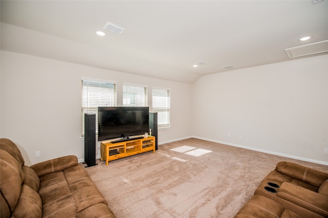 living room featuring lofted ceiling and light carpet