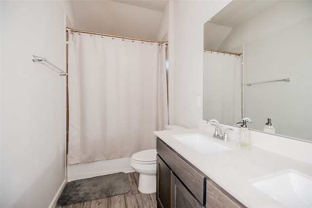 bathroom featuring hardwood / wood-style floors, toilet, and vanity