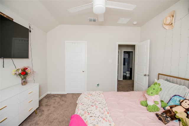 bedroom with light colored carpet, lofted ceiling, and ceiling fan