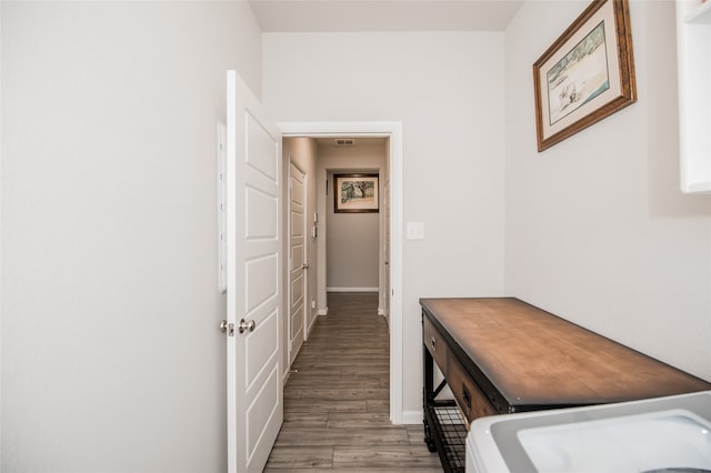 hall with hardwood / wood-style flooring and sink