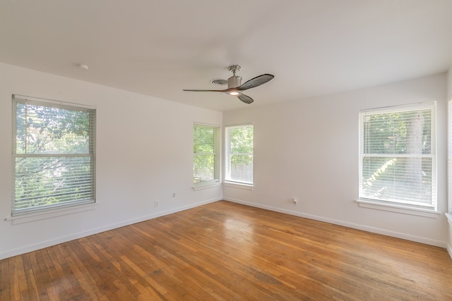 spare room featuring ceiling fan and light hardwood / wood-style floors