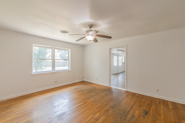 spare room featuring hardwood / wood-style flooring and ceiling fan