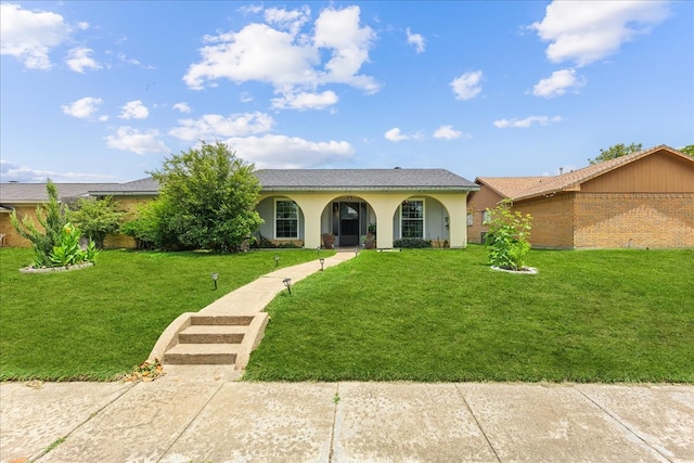 single story home featuring a front lawn