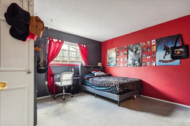 bedroom featuring a textured ceiling and carpet flooring