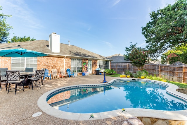 view of pool featuring a patio