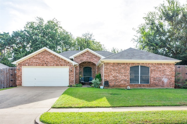 ranch-style house featuring a garage and a front yard