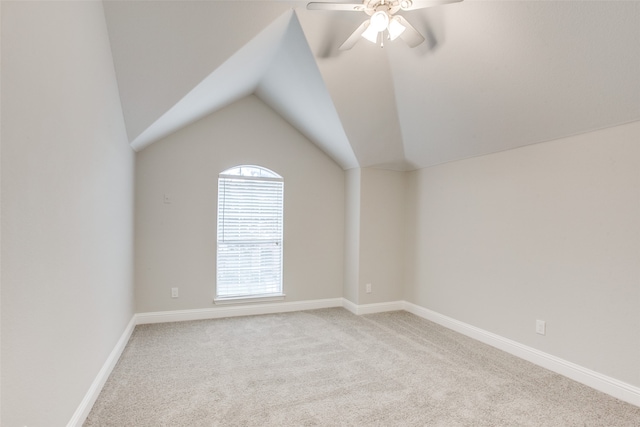 additional living space with ceiling fan, carpet flooring, and lofted ceiling