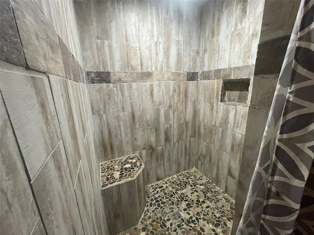 details with a tile shower