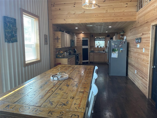 dining area featuring wood walls, dark wood-type flooring, and wooden ceiling