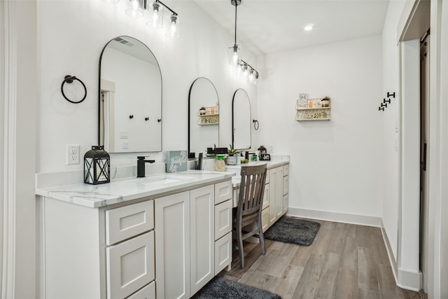 bathroom featuring hardwood / wood-style floors and vanity