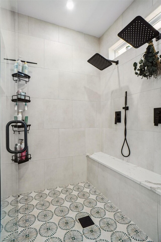 bathroom with a tile shower