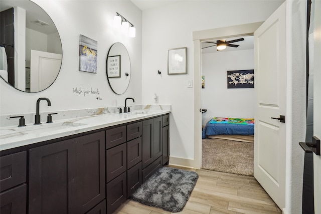 bathroom featuring hardwood / wood-style floors, vanity, and ceiling fan