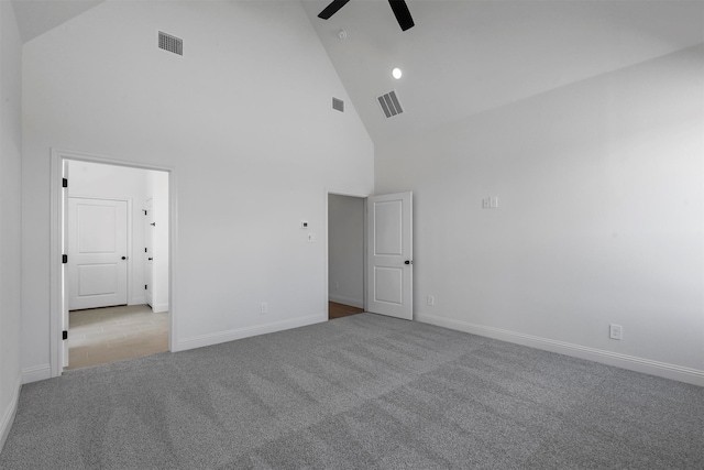 unfurnished bedroom featuring ceiling fan, high vaulted ceiling, and light carpet