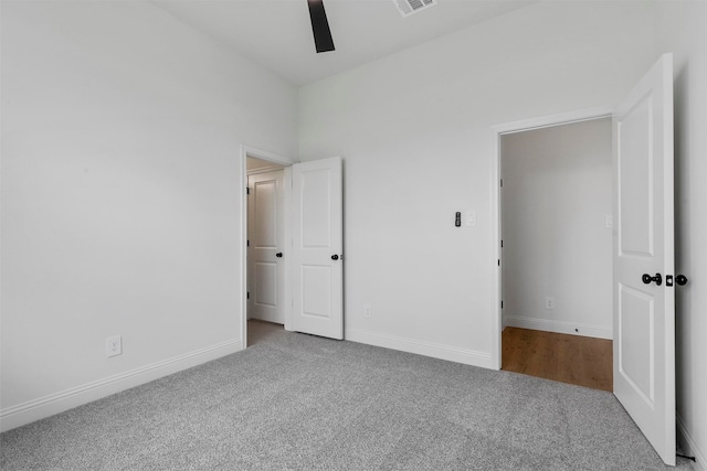 unfurnished bedroom with ceiling fan and carpet flooring