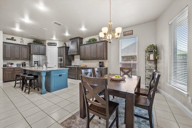 dining space with recessed lighting, a chandelier, light tile patterned floors, baseboards, and visible vents