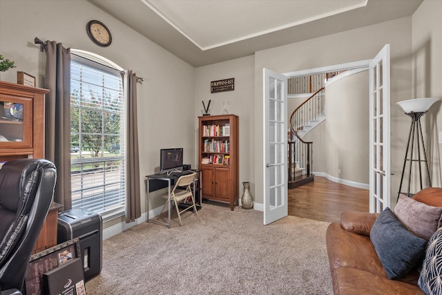 carpeted office featuring french doors and baseboards