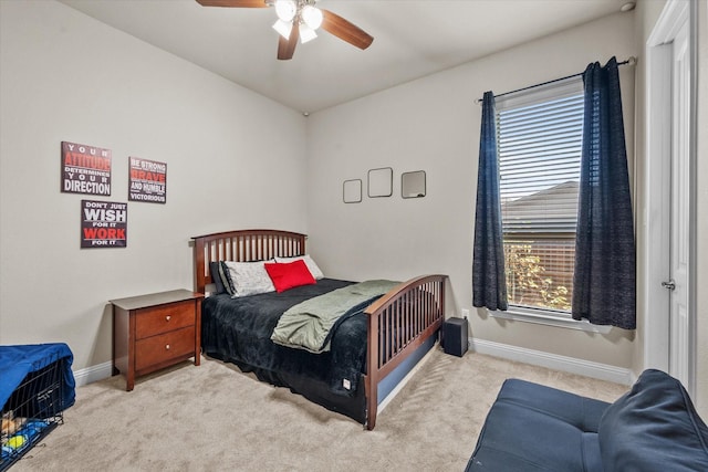 carpeted bedroom featuring a ceiling fan and baseboards