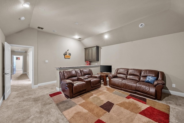 living room with vaulted ceiling, light colored carpet, visible vents, and baseboards