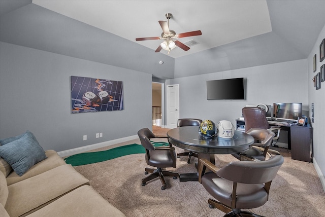carpeted dining area with a ceiling fan, visible vents, vaulted ceiling, and baseboards