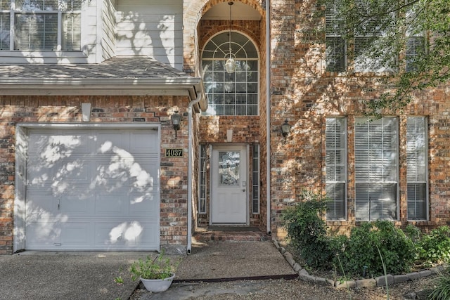 property entrance with a garage