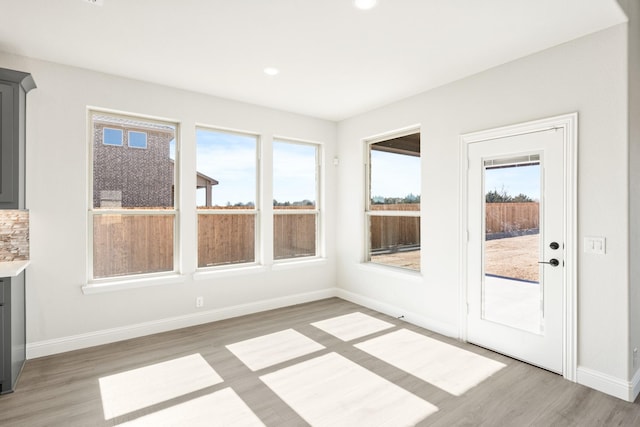 interior space featuring hardwood / wood-style flooring and a wealth of natural light