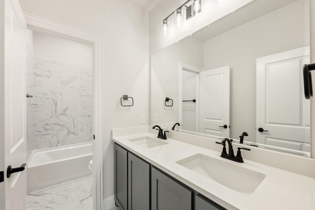 full bathroom featuring vanity, tiled shower / bath combo, and toilet