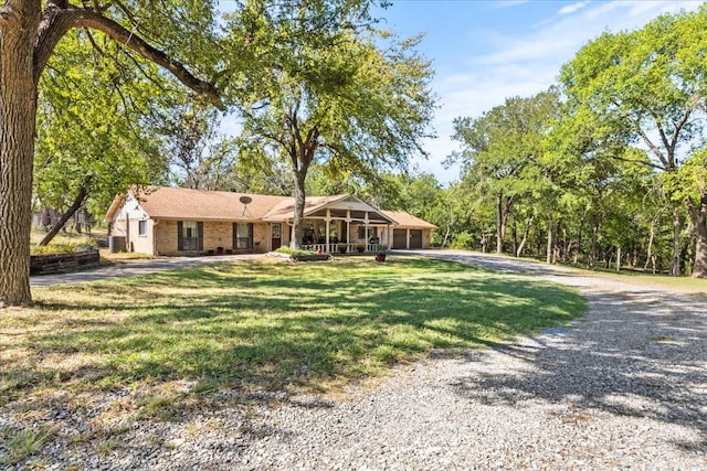 ranch-style home with a front yard