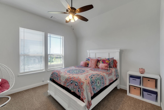 carpeted bedroom featuring ceiling fan and vaulted ceiling