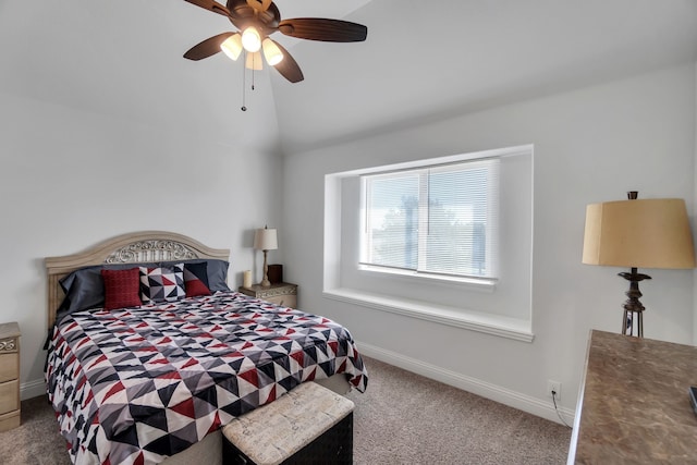 bedroom with carpet floors, ceiling fan, and vaulted ceiling