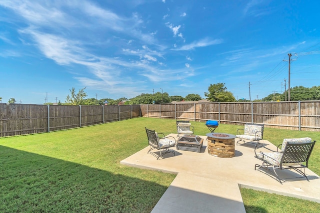 view of yard with a patio and a fire pit