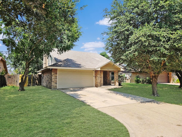 view of front facade featuring a garage and a front yard