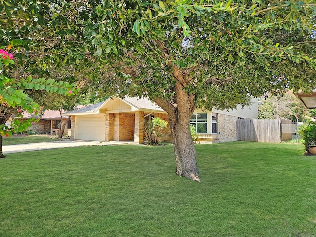 view of front facade with a garage and a front lawn